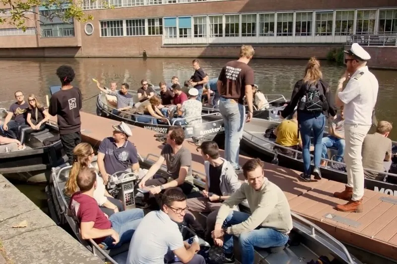 Canal Cruise Challenge Amsterdam — teams competing on the city's waterways