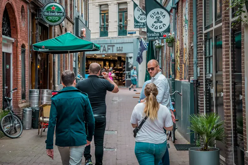 Team walking through a classic Amsterdam alley during the Treasure Hunt