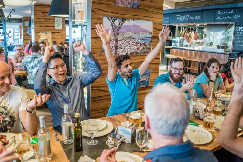 Team celebrating at a canal-side restaurant after the Treasure Hunt